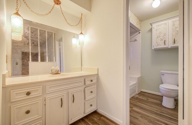 bathroom featuring hardwood / wood-style floors, vanity, and toilet