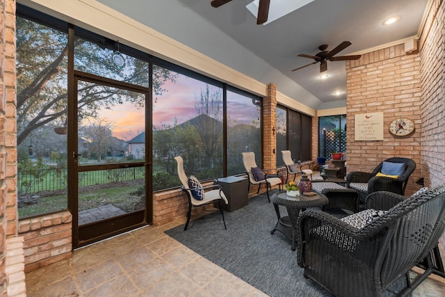 sunroom featuring ceiling fan and a healthy amount of sunlight