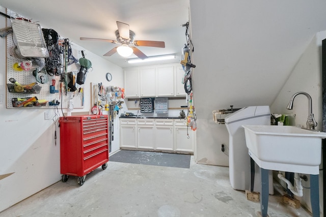 interior space featuring a workshop area, ceiling fan, and sink