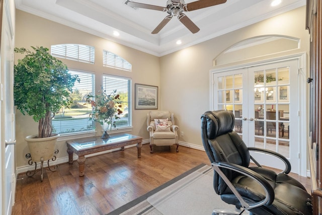 home office with french doors, a raised ceiling, ceiling fan, crown molding, and hardwood / wood-style flooring