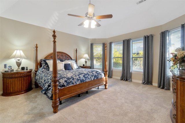 bedroom featuring ceiling fan and light carpet