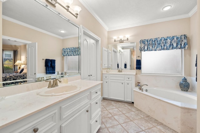 bathroom featuring vanity, a bath, tile patterned flooring, ornamental molding, and a textured ceiling