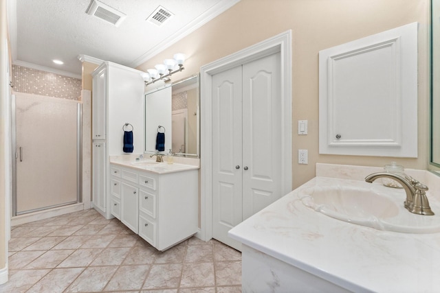 bathroom featuring tile patterned floors, walk in shower, ornamental molding, a textured ceiling, and vanity