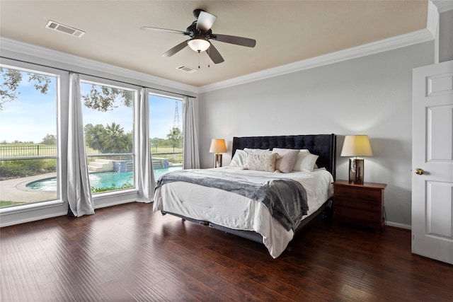 bedroom featuring ceiling fan, crown molding, and multiple windows