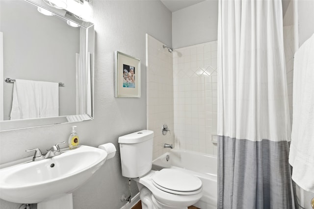 full bathroom featuring shower / bath combo, toilet, and sink