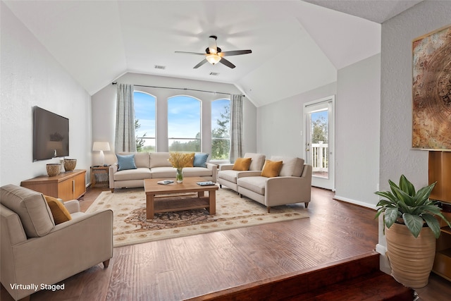 living room with ceiling fan, light hardwood / wood-style floors, and lofted ceiling