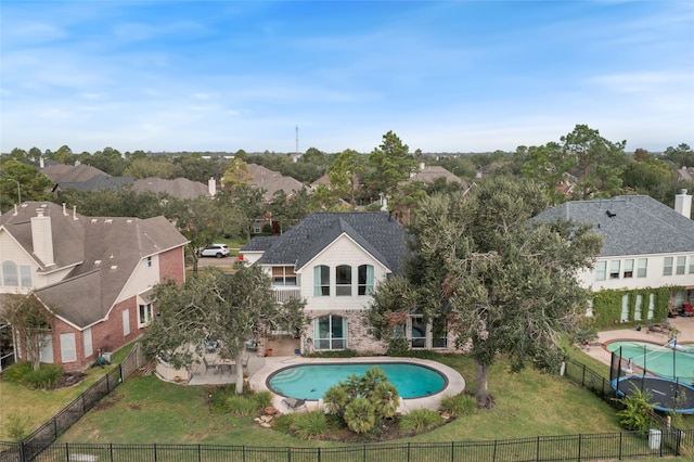 view of swimming pool featuring a lawn and a patio