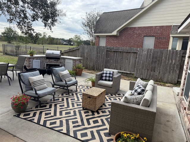 view of patio / terrace featuring area for grilling and outdoor lounge area