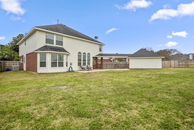 back of house featuring a yard, a patio, and central air condition unit