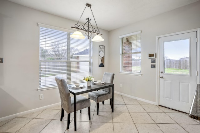 dining space featuring light tile patterned floors