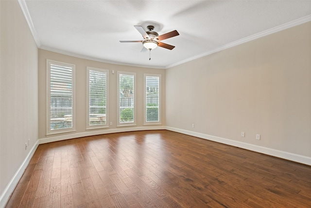 spare room with crown molding, ceiling fan, and dark hardwood / wood-style floors