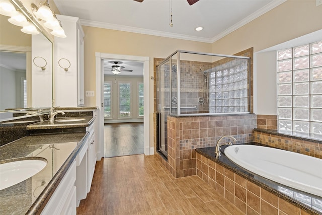 bathroom featuring hardwood / wood-style flooring, vanity, ceiling fan, and crown molding