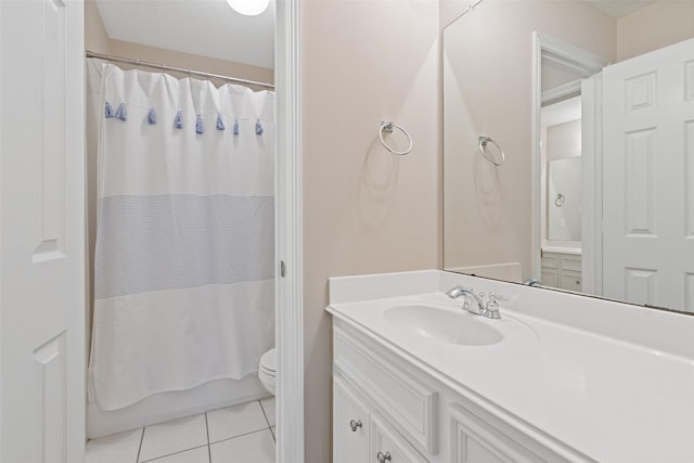 full bathroom featuring tile patterned flooring, vanity, toilet, and shower / tub combo with curtain