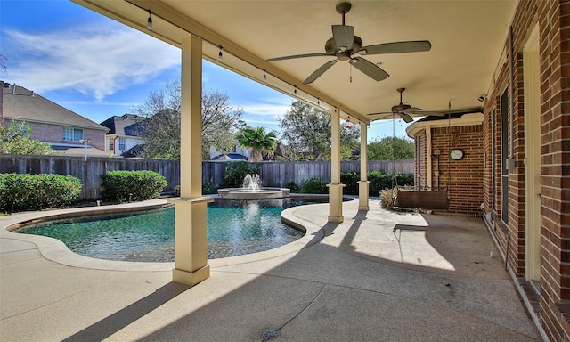 view of pool with ceiling fan and a patio area