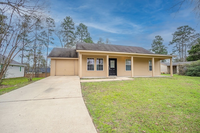 view of front of house featuring a garage, covered porch, and a front yard