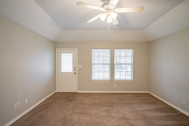 interior space with ceiling fan and vaulted ceiling