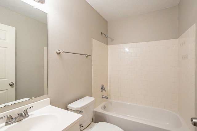 full bathroom with vanity, toilet, a textured ceiling, and washtub / shower combination