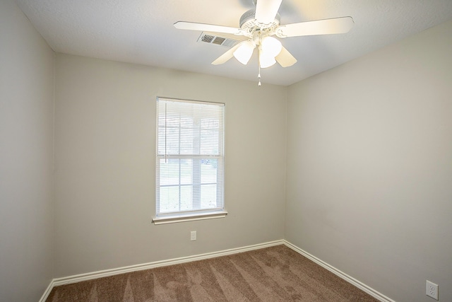 carpeted empty room with ceiling fan