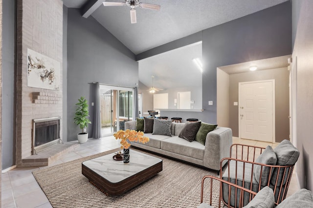 living room featuring beamed ceiling, light tile patterned floors, a fireplace, and high vaulted ceiling