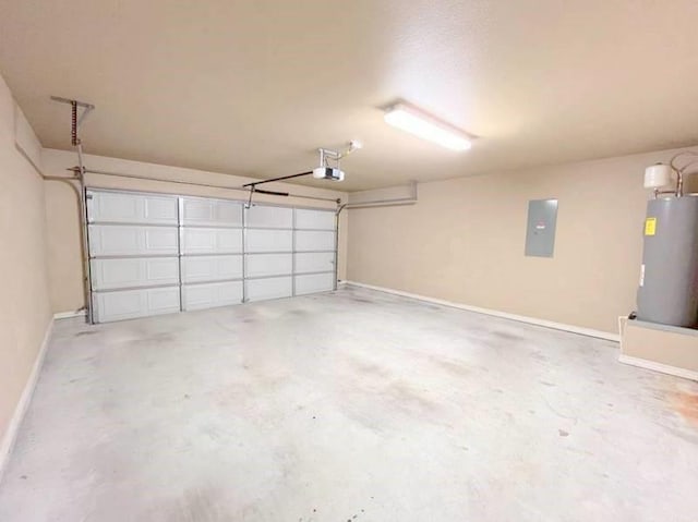 garage with a garage door opener, electric panel, and water heater