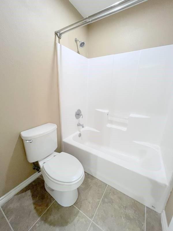 bathroom featuring  shower combination and toilet