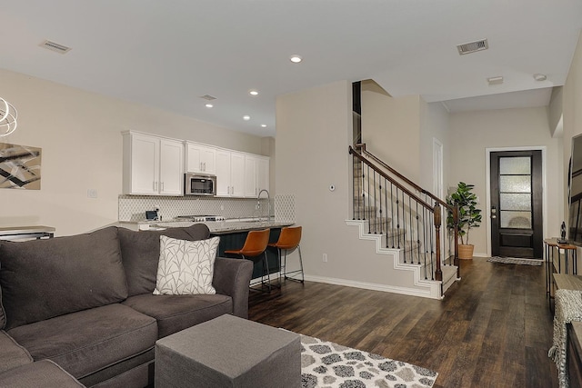 living room featuring dark hardwood / wood-style flooring