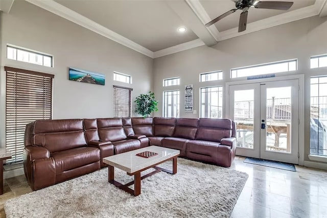 living room featuring french doors, a wealth of natural light, ceiling fan, crown molding, and beam ceiling