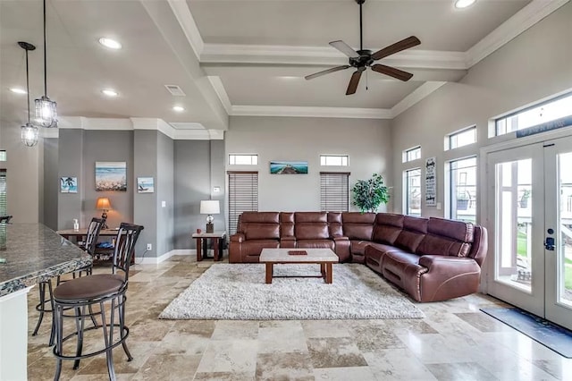 living room featuring french doors, ceiling fan, and crown molding