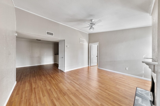 unfurnished living room with light wood-type flooring, ceiling fan, and crown molding