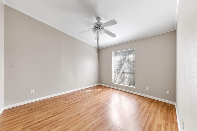 empty room with light hardwood / wood-style flooring and ceiling fan