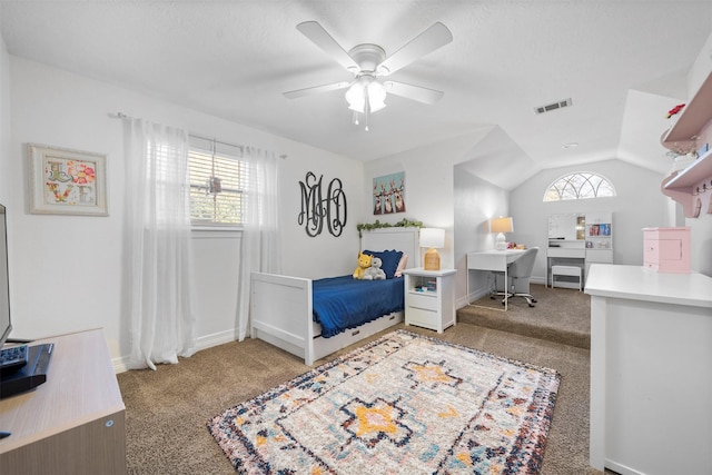 carpeted bedroom with ceiling fan, lofted ceiling, and multiple windows