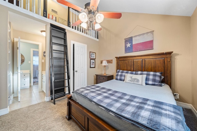 carpeted bedroom with ceiling fan and lofted ceiling