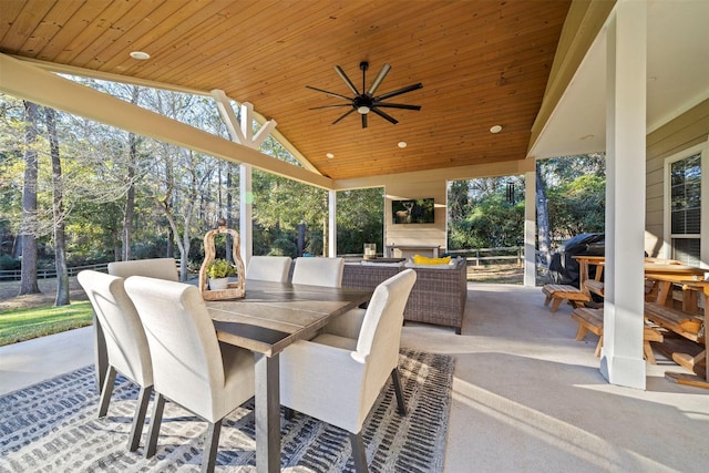 view of patio with ceiling fan and exterior fireplace