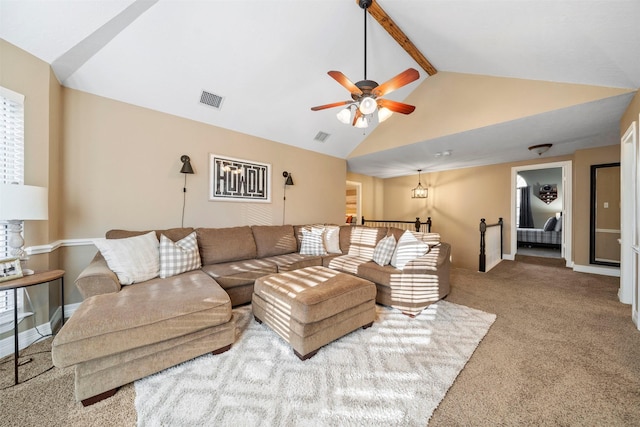 living room featuring ceiling fan, lofted ceiling with beams, and carpet