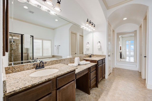 bathroom featuring crown molding, tile patterned flooring, vanity, and an enclosed shower