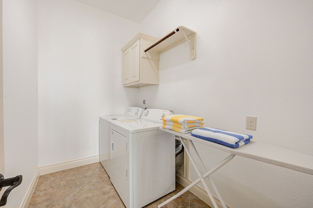 washroom featuring light tile patterned flooring, cabinets, and independent washer and dryer