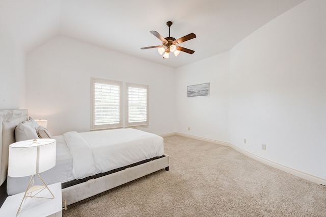 bedroom with ceiling fan, carpet, and lofted ceiling