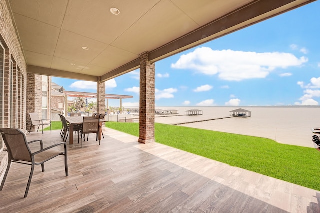 view of patio with a water view