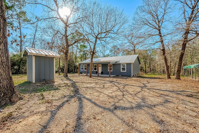 view of front facade featuring a storage unit and covered porch