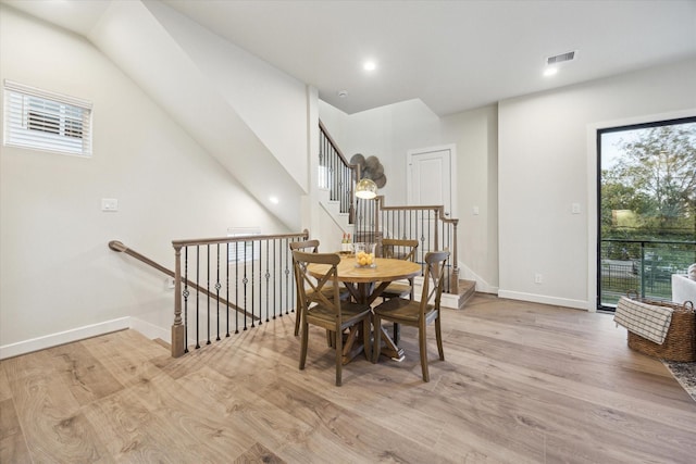 dining area with light hardwood / wood-style flooring