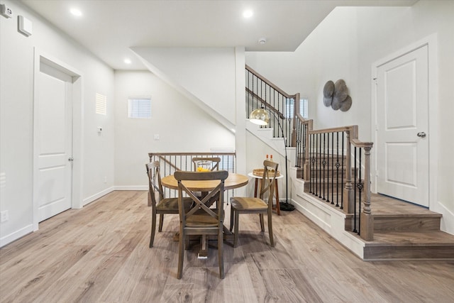 dining space with light hardwood / wood-style floors