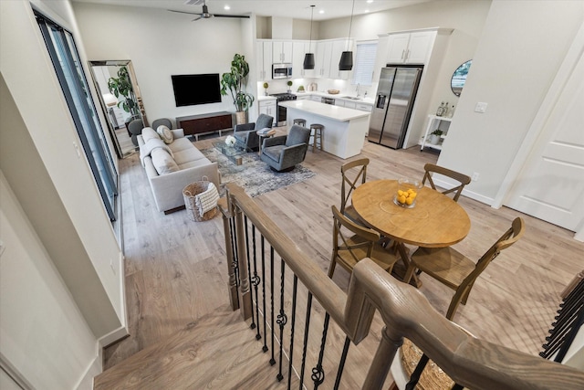 interior space featuring light wood-type flooring and ceiling fan