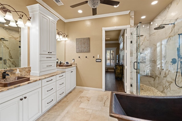 bathroom with vanity, ceiling fan, an enclosed shower, and crown molding