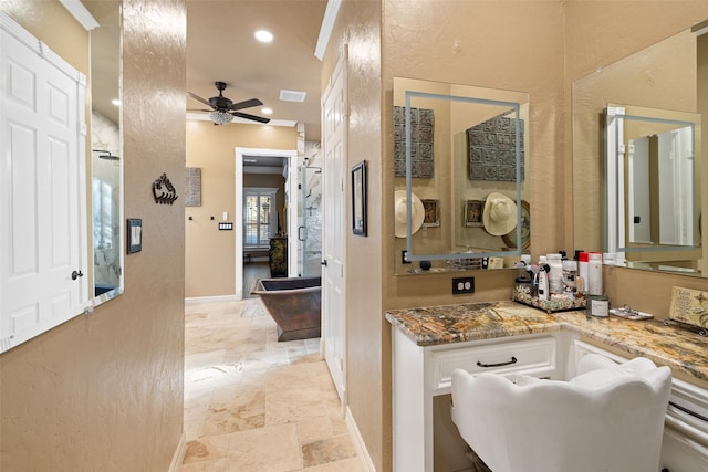 bathroom with ceiling fan and vanity