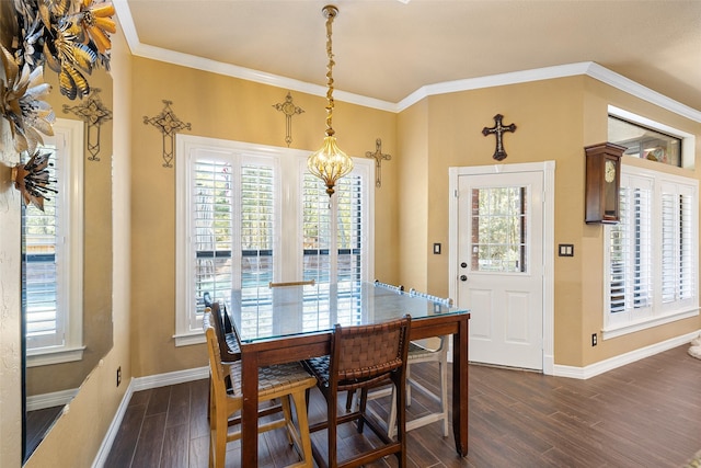 dining space with a chandelier, dark hardwood / wood-style floors, and crown molding