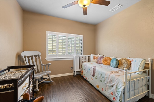 bedroom featuring ceiling fan and dark hardwood / wood-style flooring