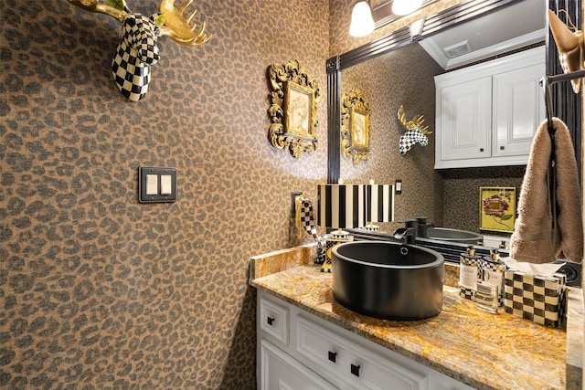 bathroom featuring vanity and crown molding