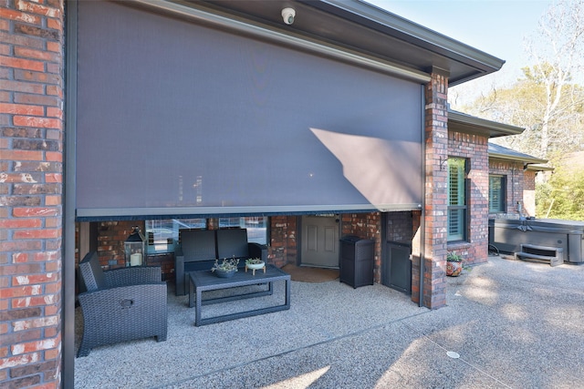 view of patio featuring a hot tub