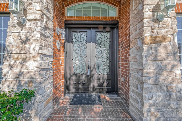 property entrance featuring french doors