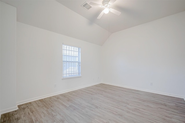 empty room featuring light hardwood / wood-style flooring, ceiling fan, and lofted ceiling